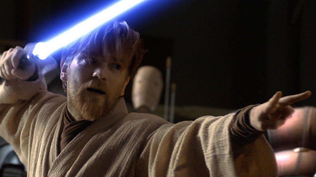 Obi-Wan Kenobi, wielding a blue lightsaber.